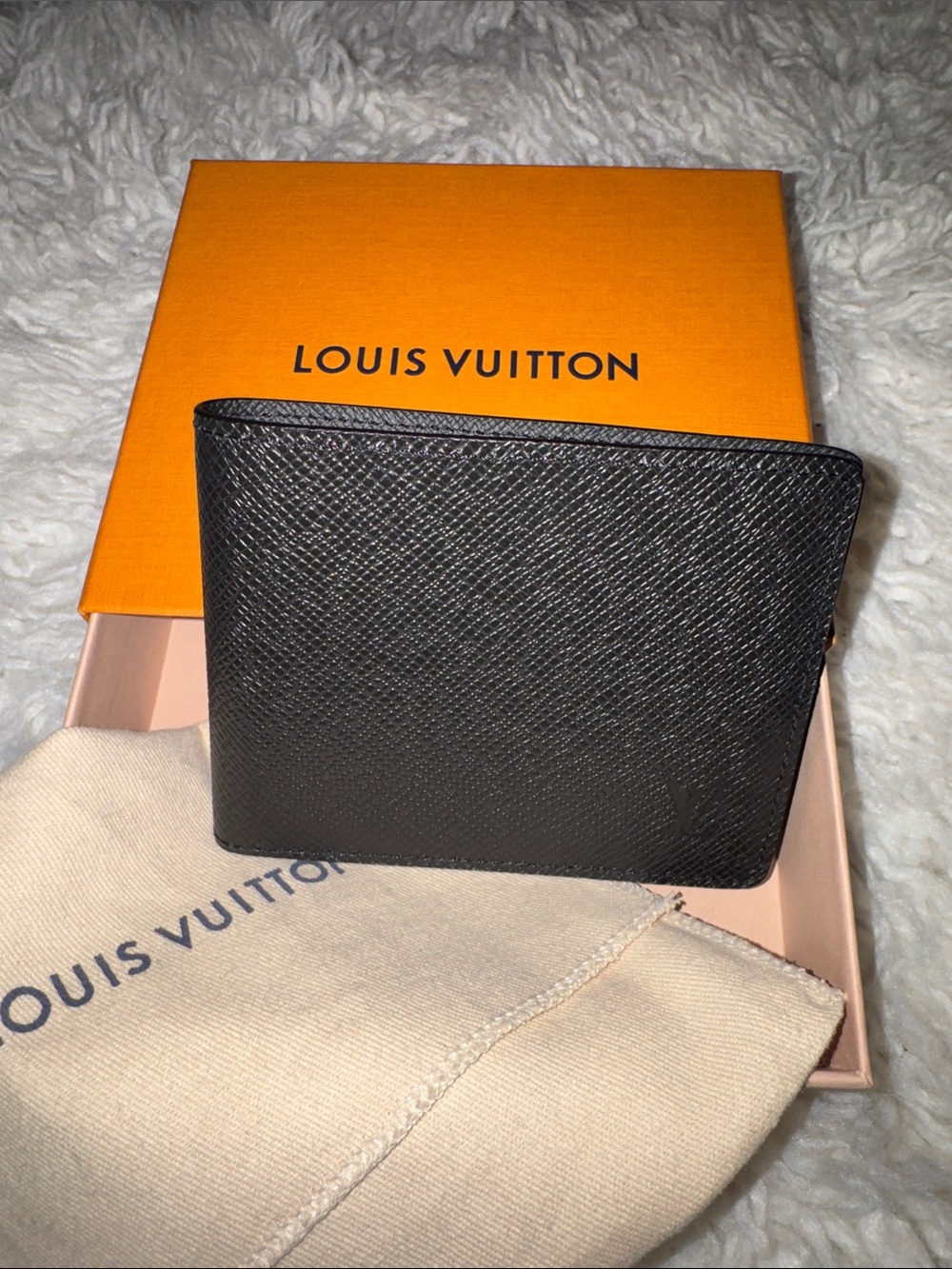 Brand new, never used Louis Vuitton Black Taiga Slim Wallet